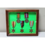 A set of five framed WWII medals with ribbons to include War Medal, Defence Medal, Italy Star,