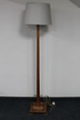 An oak Art Deco standard lamp with shade