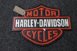 A cast iron Harley Davidson Motorcycles plaque