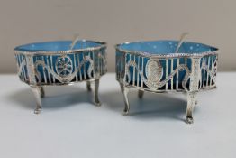 A pair of silver late Georgian open salts with blue glass liners, London marks 1824 and 1825,