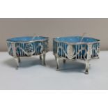 A pair of silver late Georgian open salts with blue glass liners, London marks 1824 and 1825,