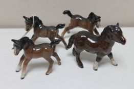 Four Beswick ponies in brown gloss