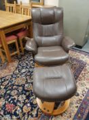 A brown leather swivel relaxer chair with matching stool