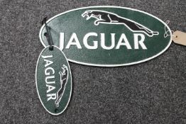 Two cast iron Jaguar plaque