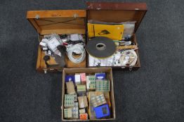 Two wooden storage boxes together with a cardboard box containing cobbler's last, hardware,