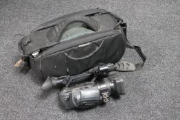 A Sony HO professional video camera with charger and batteries in carry bag