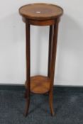 A Victorian inlaid mahogany plant stand