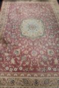 A Laura Ashley Home floral rug on pink ground