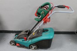 A Bosch electric lawn mower together with a Qualcast electric hedge cutter