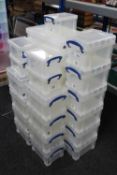 Twenty-nine assorted lidded plastic storage boxes