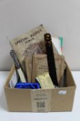 A box of Royal Mail stamp album and stamps, stamps albums, cigarette cards, vintage AA badges,