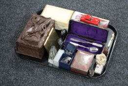 A tray of Eastern hardwood puzzle box, jewellery box, carved ebony elephants, cased knife and spoon,