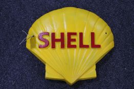 A cast iron Shell plaque