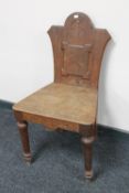 A Victorian oak hall chair