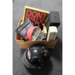 A box of motor cycle helmet, vintage camera and accessories,