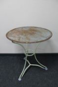 A circular metal patio table