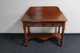 A Victorian mahogany wash stand fitted two drawers