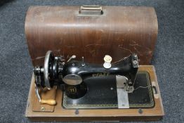 A mid 20th century mahogany cased Pfaff hand sewing machine
