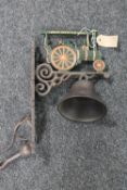 A cast iron traction engine wall bracket with bell