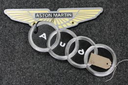Two cast iron Aston Martin and Audi signs
