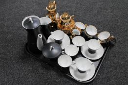 A tray containing a fifteen piece German coffee set together with a fifteen piece gilded tea