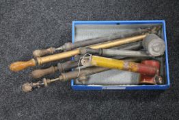 A box containing three vintage rose sprayers together with three vintage garden fumigators