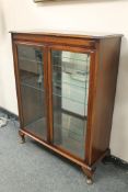 A double door mahogany display cabinet