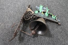 A cast iron duck wall bracket with bell