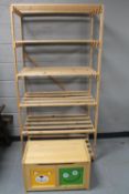 A set of pine open storage shelves together with a toy box