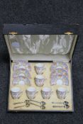 A twelve piece Royal Worcester coffee set together with six silver-gilt spoons in fitted box,