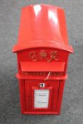 A George VI style cast iron postbox with keys