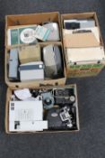 Four boxes containing a quantity of assorted vintage projectors and accessories