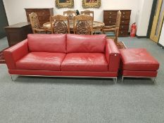 A red leather two seater settee, width 206 cm,