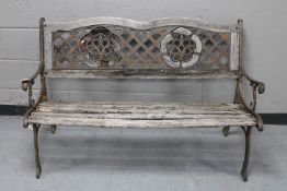 A cast iron and wood garden bench