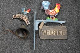 A cast iron cockerel wall bracket with welcome sign together with a further cast iron cockerel