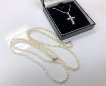 Two cultured pearl necklaces with 9ct gold clasps,