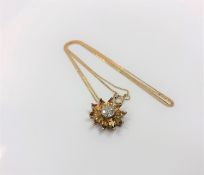 A 9ct gold diamond and citrine pendant on chain CONDITION REPORT: 2.
