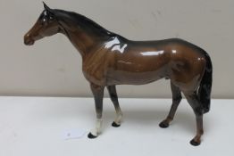 A large Beswick figure of a horse in brown gloss