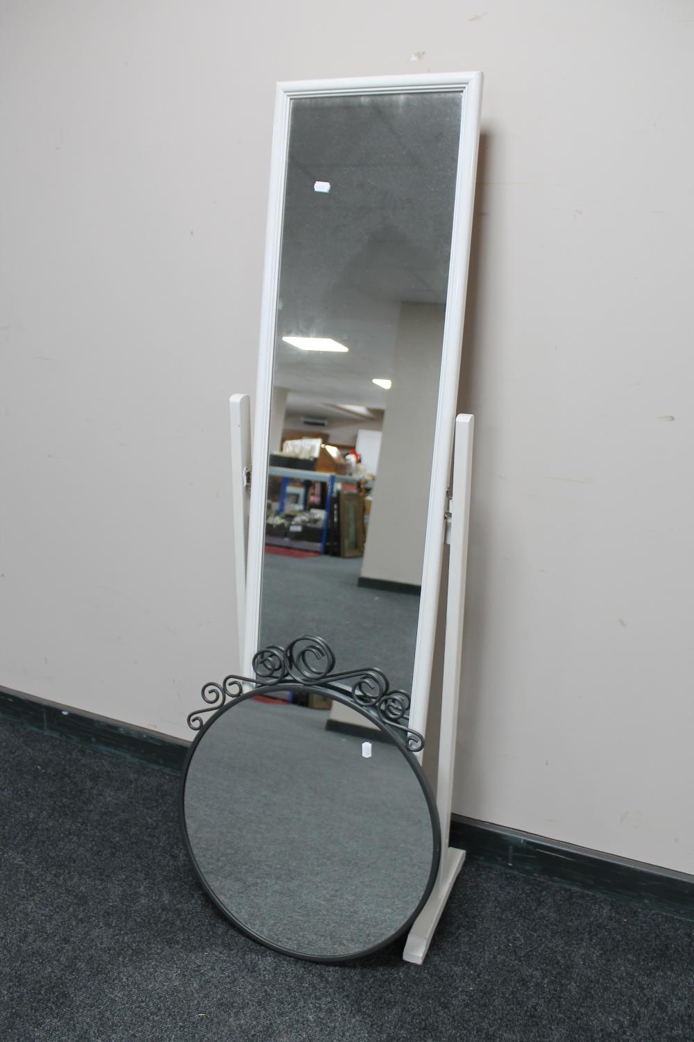 A cheval mirror together with a circular metal framed mirror