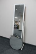 A cheval mirror together with a circular metal framed mirror