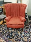 An Edwardian fire side chair with comb back,