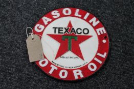 A cast iron Texaco motor oil plaque
