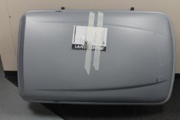 A Land Rover roof box with keys and roof bars