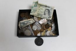A box of pre-decimal British coins, bank notes, crowns,