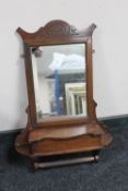 An Edwardian hall mirror with glove box