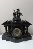 An impressive Victorian slate mantel timepiece with pendulum and key