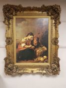 An ornately framed picture depicting two young girls,