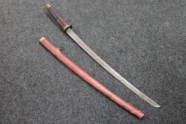 A reproduction Japanese katana in scabbard