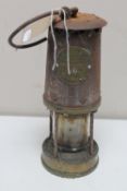 A vintage brass Eccles Protector miner's lamp type T.C.