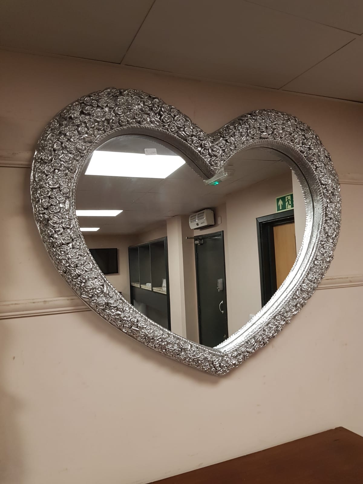 A contemporary heart shaped mirror,